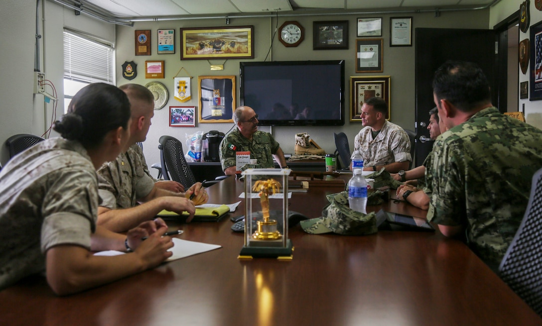 U.S. Marine Corps Col. Joseph Clearfield, commanding officer of the 15th Marine Expeditionary Unit, back right, speaks with Mexican Navy Col. Ernesto Encinas, back left, and other military officials to discuss the Rim of the Pacific 2016 exercise at Camp Pendleton, California, June 28, 2016. Twenty-six nations, more than 40 ships and submarines, more than 200 aircraft and 25,000 personnel are participating in RIMPAC from June 30 to Aug. 4, in and around the Hawaiian Islands and Southern California. The world's largest international maritime exercise, RIMPAC provides a unique training opportunity that helps participants foster and sustain the cooperative relationships that are critical to ensuring the safety of sea lanes and security on the world's oceans. RIMPAC 2016 is the 25th exercise in the series that began in 1971.