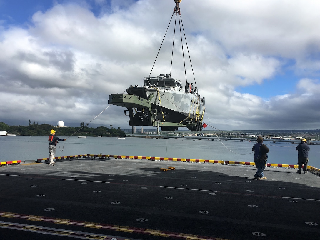 A Riverine Command Boat (RCB) from Coastal Riverine Squadron 3 (CRS-3) is unloaded off of amphibious assault ship USS America (LHA 6) for Rim of the Pacific 2016. Twenty-six nations, more than 40 ships and submarines, more than 200 aircraft, and 25,000 personnel are participating in RIMPAC from June 30 to Aug. 4, in and around the Hawaiian Islands and Southern California. The world's largest international maritime exercise, RIMPAC provides a unique training opportunity that helps participants foster and sustain the cooperative relationships that are critical to ensuring the safety of sea lanes and security on the world's oceans. RIMPAC 2016 is the 25th exercise in the series that began in 1971. 