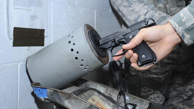 U.S. Air Force Airman 1st Class Matthew Wolf, 355th Security Forces Squadron member, clears his M9 at Davis-Monthan Air Force Base, Ariz., July 7, 2016. The 355th SFS mission is to protect, defend and fight to enable Air Force, joint and coalition mission success. (U.S. Air Force photo by Airman 1st Class Mya M. Crosby/Released)