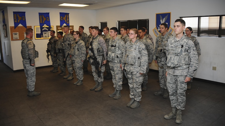 U.S. Airmen assigned to the 355th Security Forces Squadron perform open ranks during guard mount at Davis-Monthan Air Force Base, Ariz., July 7, 2016. The 355th SFS consists of over 300 military and civilian personnel. (U.S. Air Force photo by Airman 1st Class Mya M. Crosby/Released)