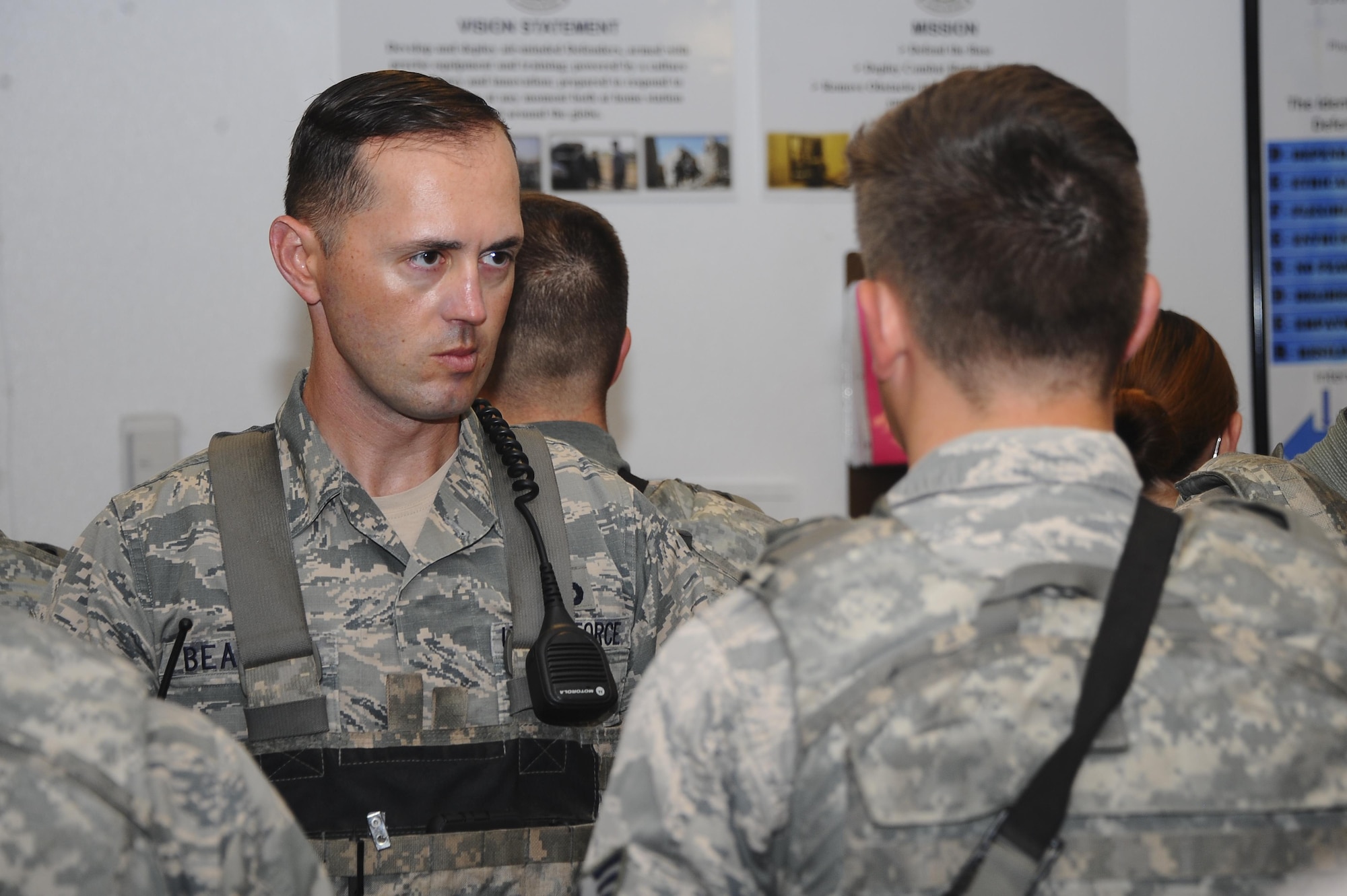 U.S. Air Force Master Sgt. David Beasley, 355th Security Forces Squadron trainer, checks an Airman’s dress and appearance during open ranks at Davis-Monthan Air Force Base, Ariz., July 7th, 2016. Security Forces members are responsible for ensuring the safety of base weapons, property and personnel from hostile forces. (U.S. Air Force photo by Airman 1st Class Mya M. Crosby/Released)