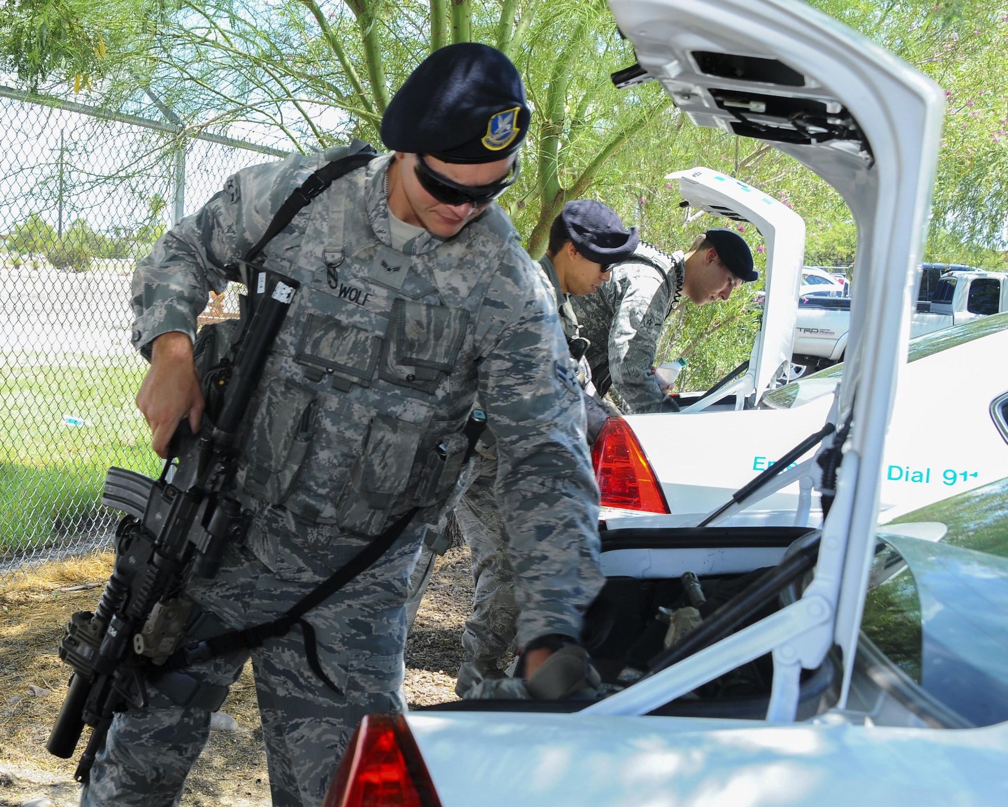 U.S. Air Force Airman 1st Class Matthew Wolf, 355th Security Forces Squadron member, loads his equipment into a vehicle at Davis-Monthan Air Force Base, Ariz., July 7, 2016. The 355th SFS mission is to protect, defend and fight to enable Air Force, joint and coalition mission success. (U.S. Air Force photo by Airman 1st Class Mya M. Crosby/Released)