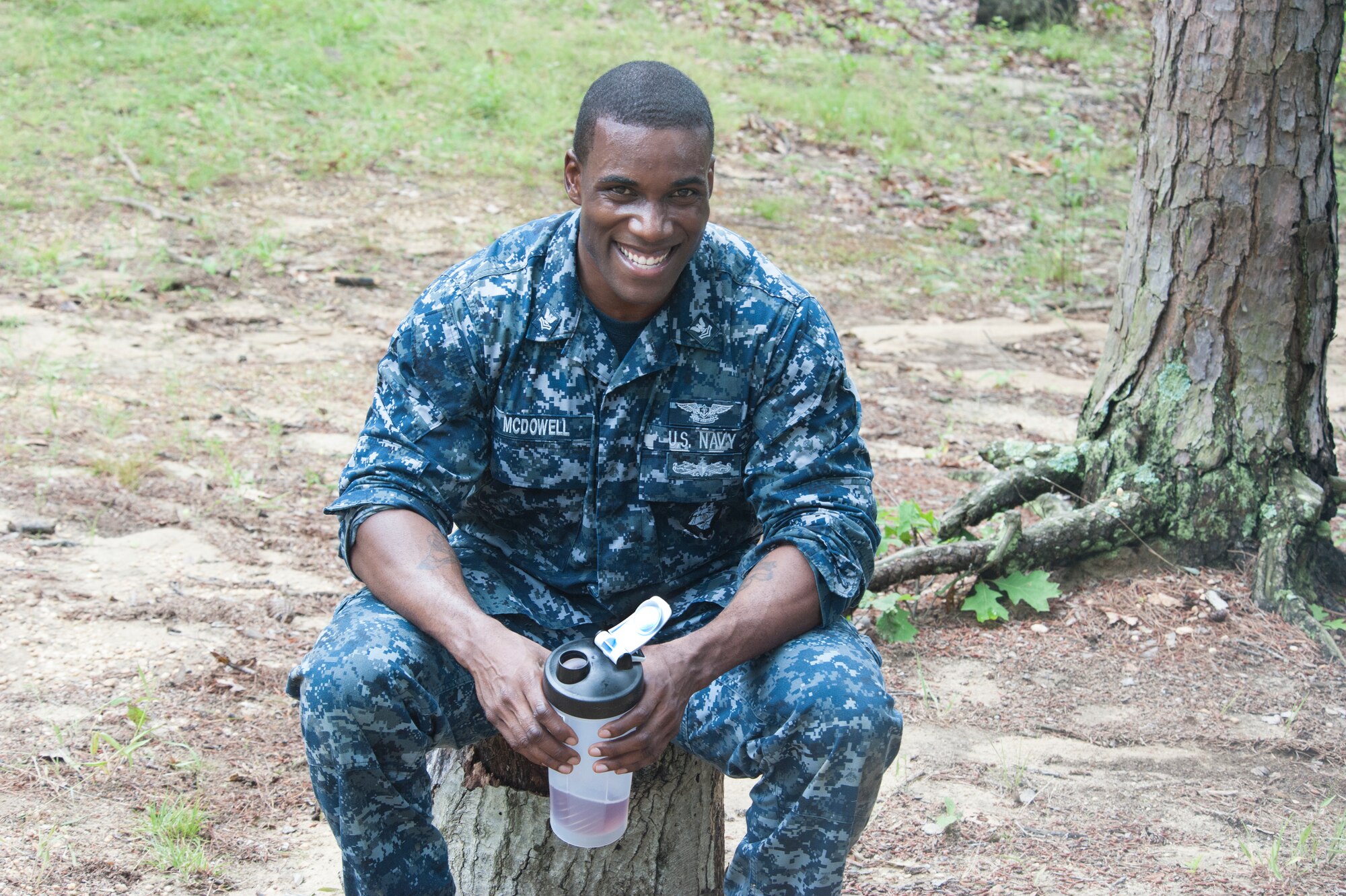 Petty Officer 2nd Class Ronnie McDowell, Aviation Support Detachment’s lead petty officer, takes a break during a brief pause between physical activities in the service member of the year competition June 28, 2016 at Joint Base McGuire-Dix-Lakehurst, New Jersey. The first day of the competition included a physical fitness assessment, ruck march, first aid on a training mannequin, two different obstacle courses and weapons qualification at a virtual firing range.




