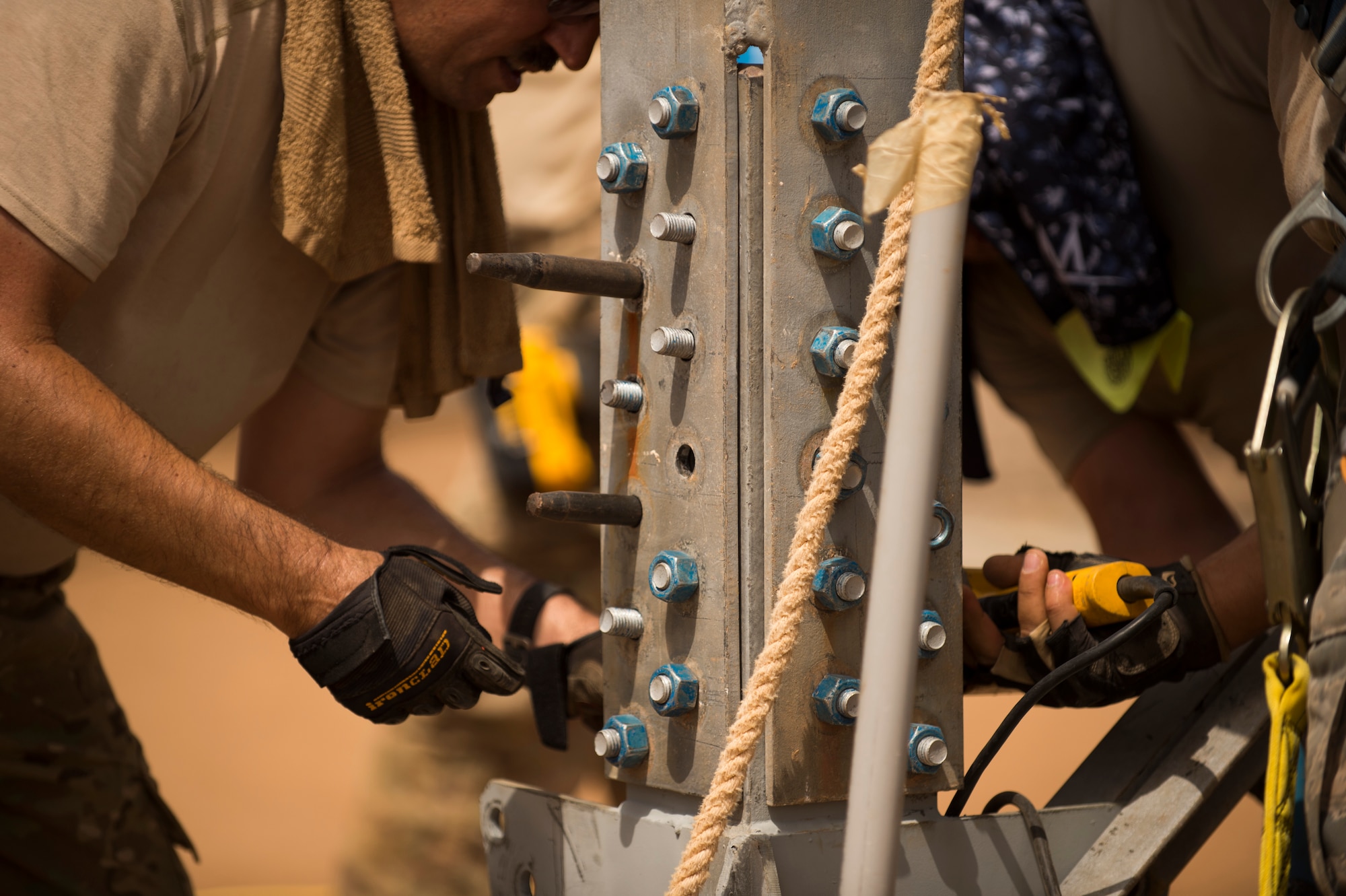 U.S. Airmen of the 205th Engineering Installation Squadron, Oklahoma City, install a new AN/GPN-27 Airport Surveillance Radar System tower, May 26, 2016, at Camp Lemonnier, Djibouti. With coordination between the 205 EIS, U.S. Air Forces in Europe, U.S. Air Force Flight Standards Agency, U.S. Air Force Central Command and the U.S. Navy, the new radar will increase air traffic control capabilities and safety. (U.S. Air Force photo by Staff Sgt. Tiffany DeNault)