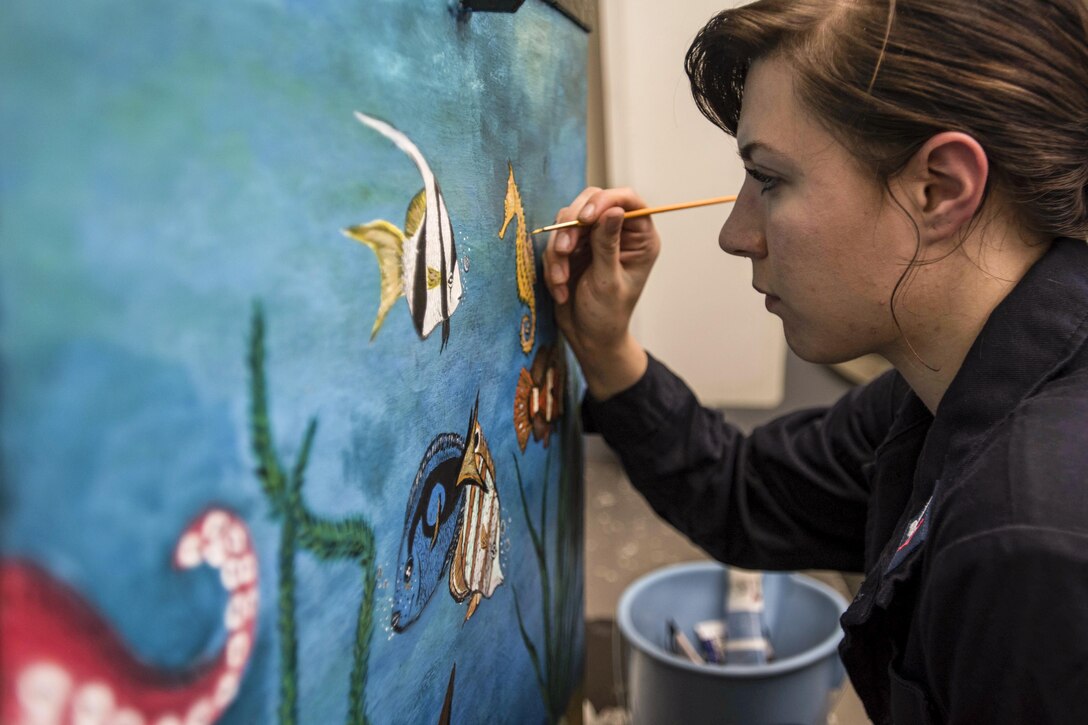 Navy Petty Officer 3rd Class Taylor Miller paints a stowage box aboard the USS Dwight D. Eisenhower in the Mediterranean Sea, July 4, 2016. The aircraft carrier is supporting Operation Inherent Resolve, maritime security operations and theater security operation efforts in the U.S. 6th Fleet area of operations. Navy photo by Seaman Apprentice Joshua Murray