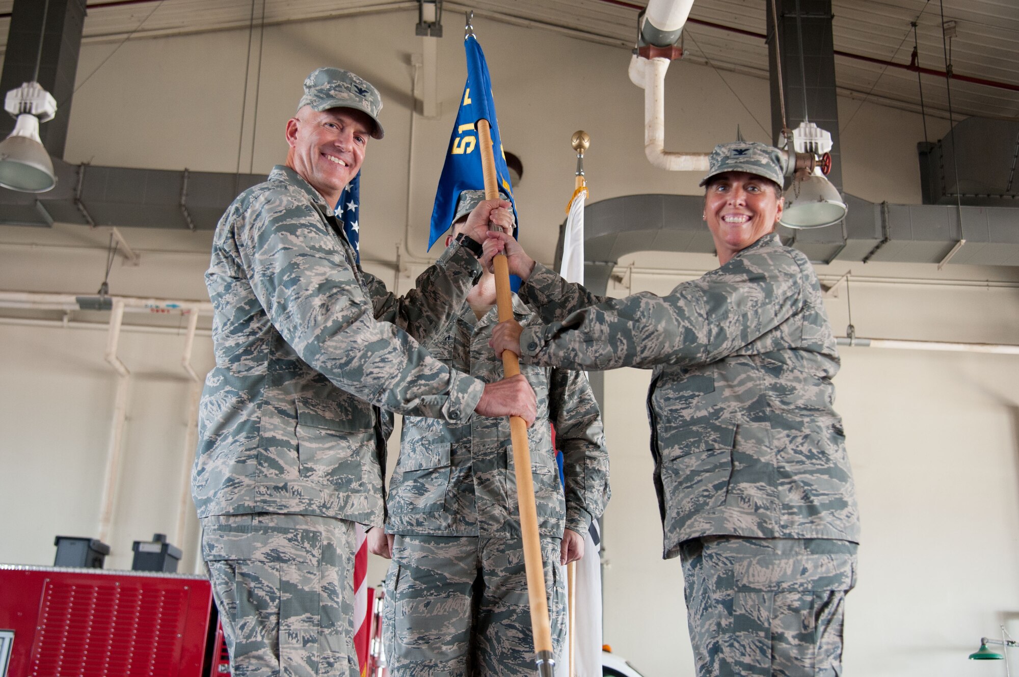 Col. Kerry Proulx, 51st Mission Support Group commander, accepts the unit guidon from Col. Andrew Hansen, 51st Fighter Wing commander, during a change-of-command ceremony at Osan Air Base, Republic of Korea, July 6, 2016. The group, made up of five diverse squadrons totaling more than 2,600 personnel, supports the Air Force's most permanently forward-deployed wing, a numbered Air Force and 20 tenant units. (U.S. Air Force photo by Staff Sgt. Jonathan Steffen/Released)