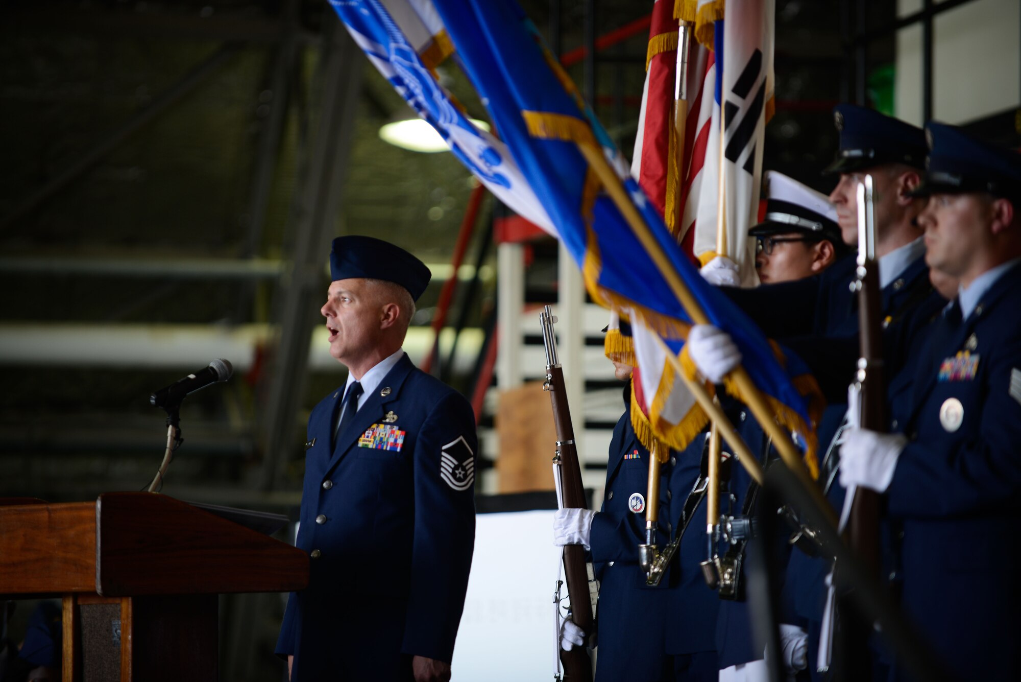 Master Sgt. John Norman, 731st Air Mobility Squadron, sings the Korean and U.S. national anthems during the Seventh Air Force change of command ceremony at Osan Air Base July 8, 2016. Lt. Gen. Thomas W. Bergeson became the 34th commander of Seventh Air Force, taking over for Lt. Gen. Terrence J. O'Shaughnessy who moves on to take over as Pacific Air Forces commander. (U.S. Air Force photo by Senior Airman Dillian Bamman/Released)