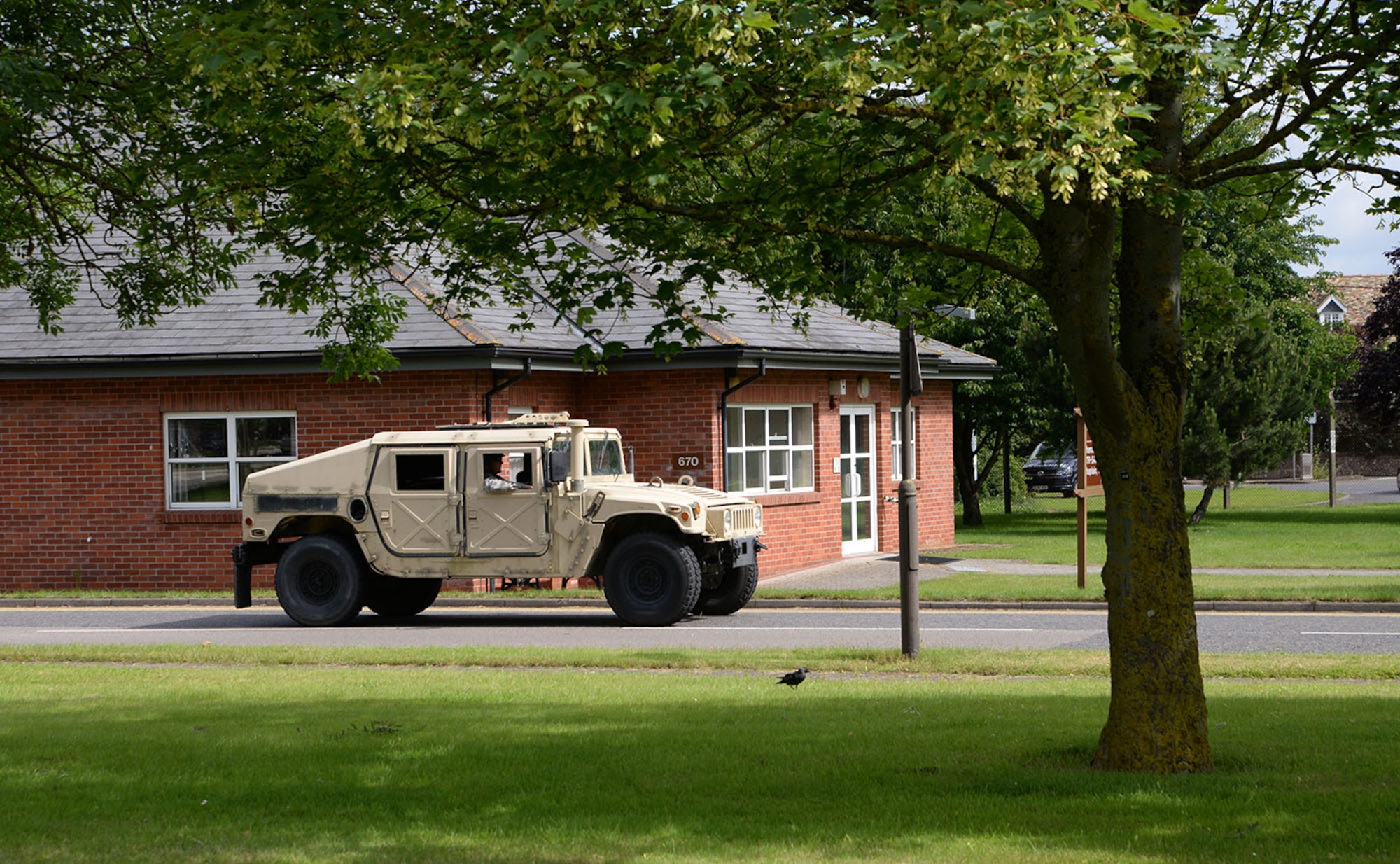U.S. Air Force Airmen from the 100th Civil Engineer Squadron drive a Humvee around base as part of their Prime Base Engineer Emergency Force training June 30, 2016, on RAF Mildenhall, England. The training is held annually and provides the 100th CES Airmen with the knowledge and hands-on experience to prepare them for a deployed environment. (U.S. Air Force photo by Karen Abeyasekere/Released)