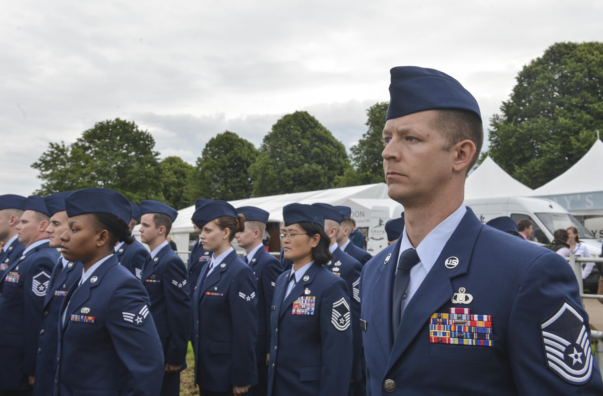 Royal Air Force Lakenheath Airmen stand at attention during the Royal Norfolk Show in Norfolk, England, June 30. Invited by the Norfolk County Council, RAF Lakenheath participated in the annual Royal Norfolk Show, showcasing military branches in the local community. (U.S. Air Force photo/Senior Airman Nigel Sandridge)