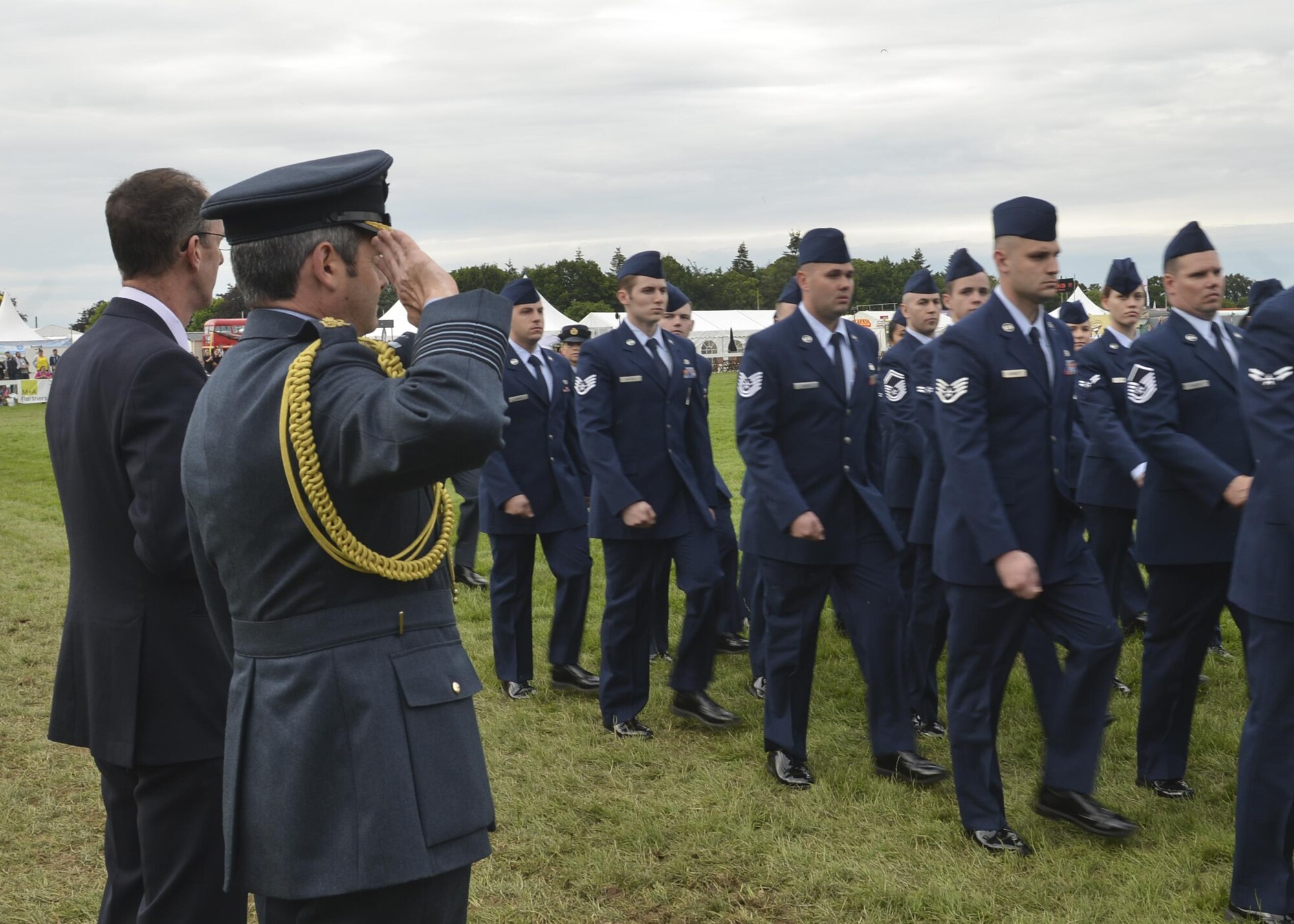 A reviewing official renders a salute to Liberty Airmen during the Royal Norfolk Show in Norfolk, England, June 30. Invited by the Norfolk County Council, Royal Air Force Lakenheath participated in the annual Royal Norfolk Show, showcasing military branches in the local community. (U.S. Air Force photo/Senior Airman Nigel Sandridge)