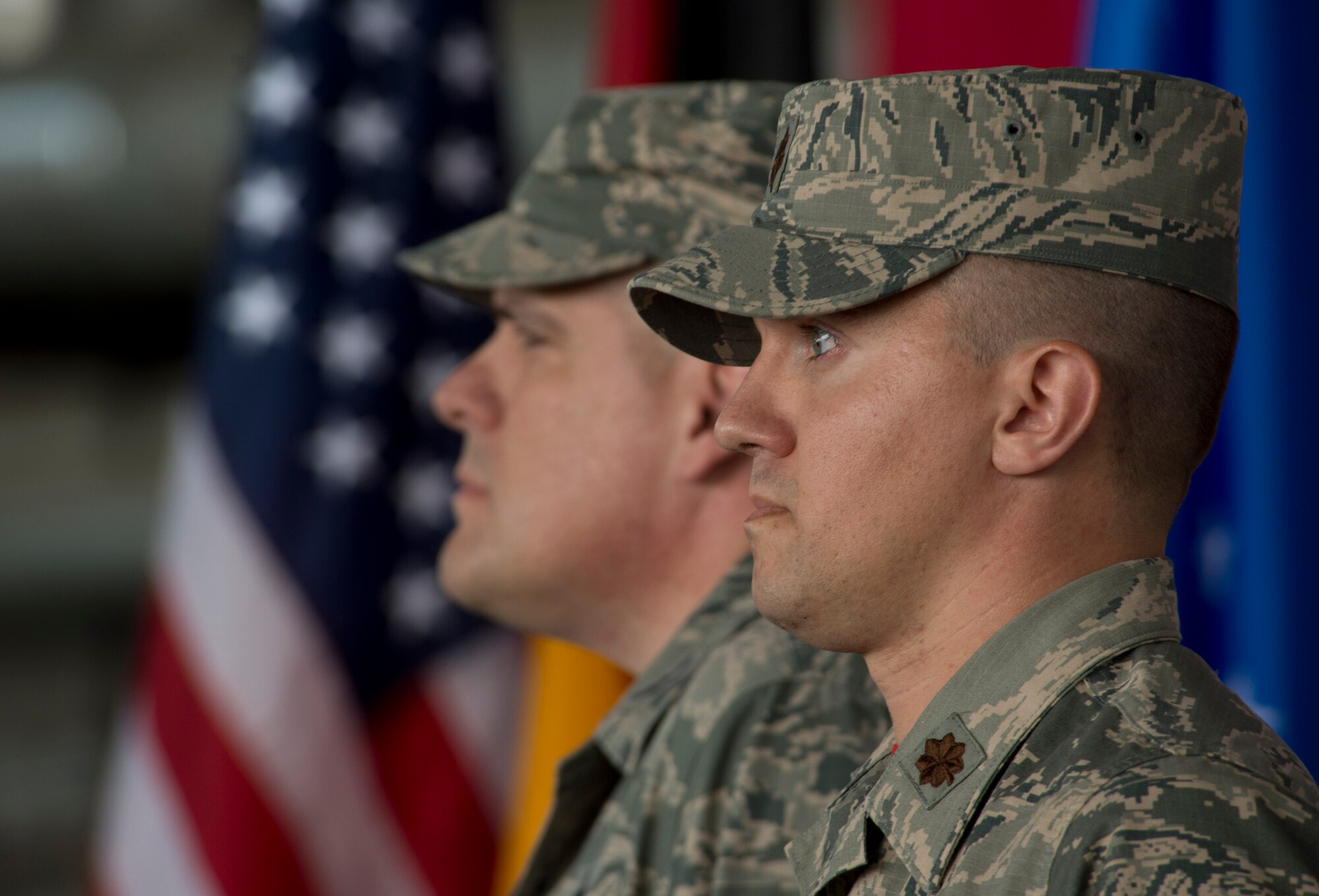 U.S. Air Force Col. Stephen Scherzer, 52nd Maintenance Group commander, left, and U.S. Air Force Maj. John Szczepanski, incoming 52nd Aircraft Maintenance Squadron commander, right, stand at attention during an assumption of command ceremony at Hangar One on Spangdahlem Air Base, Germany, July 8, 2016. More than 100 52nd Fighter Wing Airmen and family members attended the ceremony where Szczepanski assumed command of the 52nd AMXS. (U.S. Air Force Photo by Staff Sgt. Joe W. McFadden/Released)
