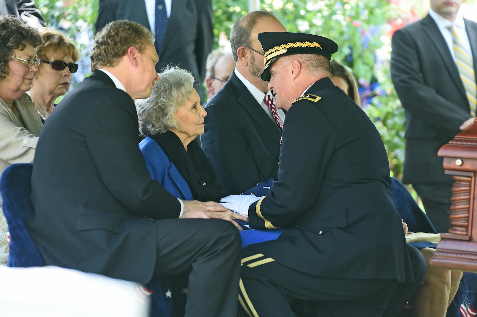 Maj. Gen. Glenn H. Curtis, the adjutant general of the Louisiana National Guard, presents the American flag to Jane Stroud, wife of Maj. Gen. Ansel M. Stroud, Jr., during his interment, July 7, 2016, at Forest Park Cemetery, Shreveport, La. In 1997, the Jackson Barracks military museum was named the Ansel M. Stroud, Jr., History and Weapons Museum. 