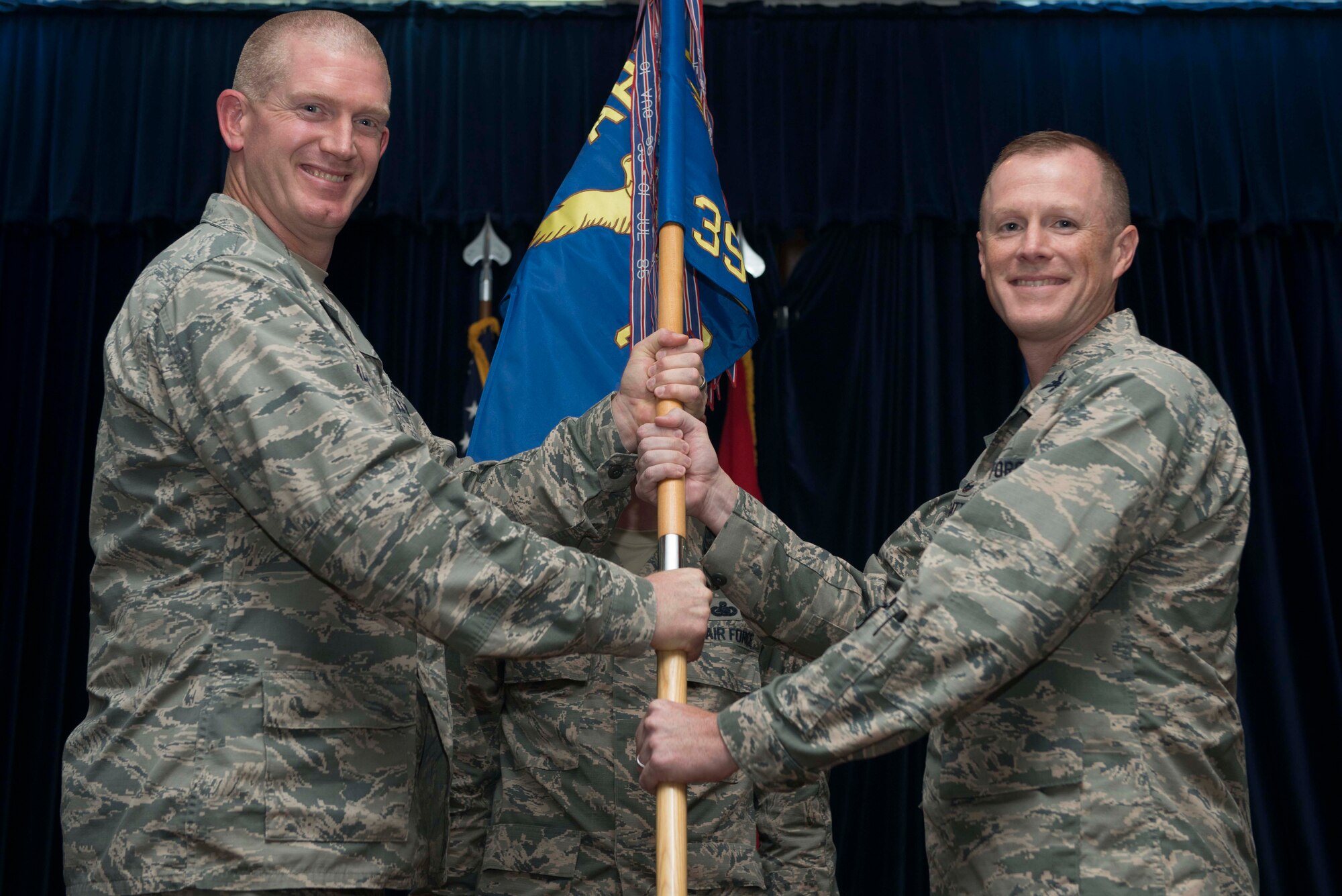U.S. Air Force Col. Todd Stratton, 39th Mission Support Group incoming commander, receives command from U.S. Air Force Col. John Walker, 39th Air Base Wing commander, during a change of command ceremony July 8, 2016, at Incirlik Air Base, Turkey. Prior to taking command, Stratton was the chief of defensive cyberspace operations at Headquarters U.S. Special Operations Command, MacDill Air Force Base, Fla. (U.S. Air Force photo by Senior Airman John Nieves Camacho/Released)