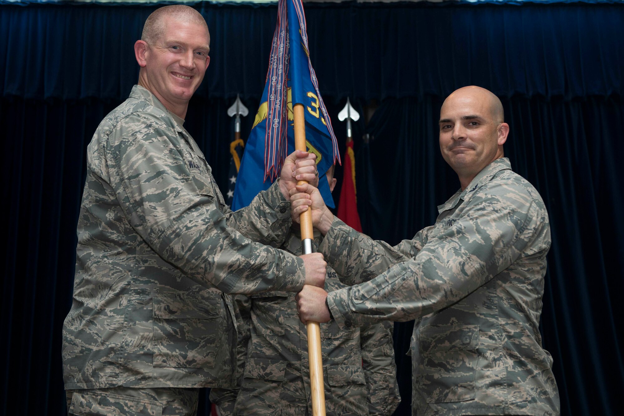 U.S. Air Force Col. Russell Voce, 39th Mission Support Group outgoing commander, relinquishes command to U.S. Air Force Col. John Walker, 39th Air Base Wing commander, during a change of command ceremony July 8, 2016, at Incirlik Air Base, Turkey. A change of command ceremony is a tradition that represents a formal transfer of authority and responsibility from the outgoing commander to the incoming commander. (U.S. Air Force photo by Senior Airman John Nieves Camacho/Released)