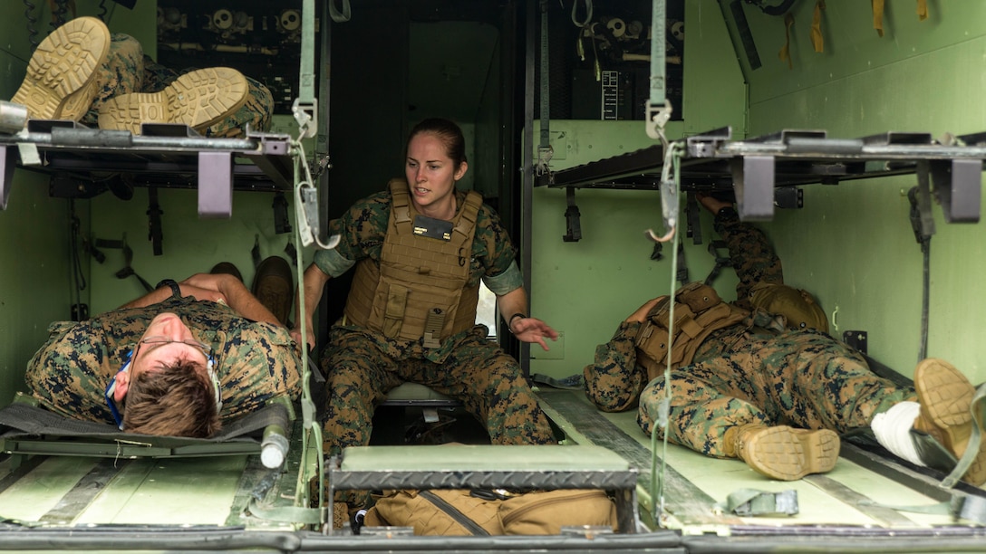 U.S. Navy Petty Officer 3rd Class Rebecca Hurst, a corpsman with the Robert M. Casey Medical and Dental Clinic at Marine Corps Air Station Iwakuni, treats simulated victims during exercise Eagle Wrath 2016 at Combined Arms Training Center Camp Fuji, Japan, July 8, 2016. Marine Wing Support Squadron (MWSS) 171 plans to complete their unit annual training requirements throughout three stages, which focuses on air base ground defense and Marine Corps common skills that Marines are unable to train for locally. To wrap up exercise Eagle Wrath 2016, ‘America’s squadron’ will conquer Mount Fuji before packing up gear and washing down equipment. 