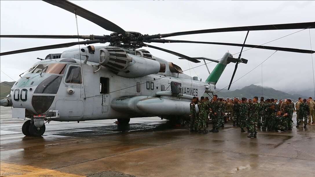 U.S. Marines, Australian and Indonesian soldiers gather around a CH-53E Super Stallion helicopter July 5, 2016, at Marine Corps Base Hawaii. This training is designed to enhance the interoperability of the combined RIMPAC during military operations in the maritime environment. Exercise Rim of the Pacific 16 is the world's largest international maritime exercise, and provides a unique training opportunity that helps participants foster and sustain cooperative relationships that are critical to ensuring the safety of sea lanes and on the world's oceans. RIMPAC 2016 is the 25th exercise in the series that began in 1971. 