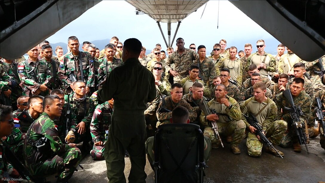 Cpl. Gilbert Munoz, a CH-53E Super Stallion helicopter crew chief, instructs U.S. Marines, Indonesian and Australian soldiers how to properly get in a seat July 5, 2016, at Marine Corps Base Hawaii. This training is designed to enhance the interoperability of the combined RIMPAC forces during military operations in the maritime environment. Exercise Rim of the Pacific 16 is the world's largest international maritime exercise, and provides a unique training opportunity that helps participants foster and sustain cooperative relationships that are critical to ensuring the safety of sea lanes and on the world's oceans. RIMPAC 2016 is the 25th exercise in the series that began in 1971. 