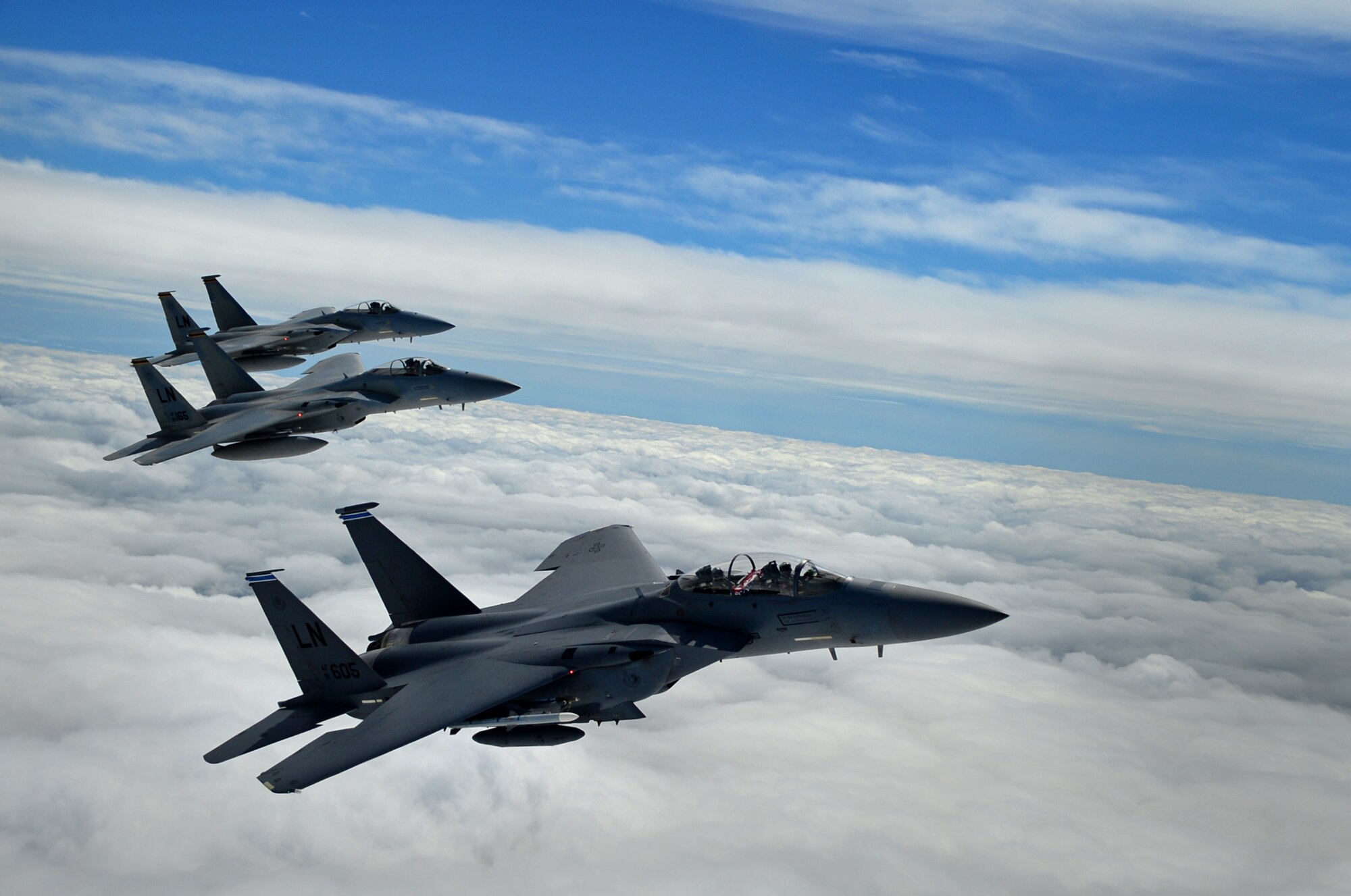 A formation of F-15C Eagles assigned to the 493rd Fighter Squadron, and an F-15E Strike Eagle assigned to the 492nd Fighter Squadron, fly over Gloucestershire, England, to attend the upcoming Royal International Air Tattoo airshow held at RAF Fairford July 7. The RAF Lakenheath aircraft will be on public display, along with many other military aircraft from around the U.K., to provide an opportunity for U.S. and military allies to showcase their capabilities. (U.S. Air Force photo/Senior Airman Erin Trower)