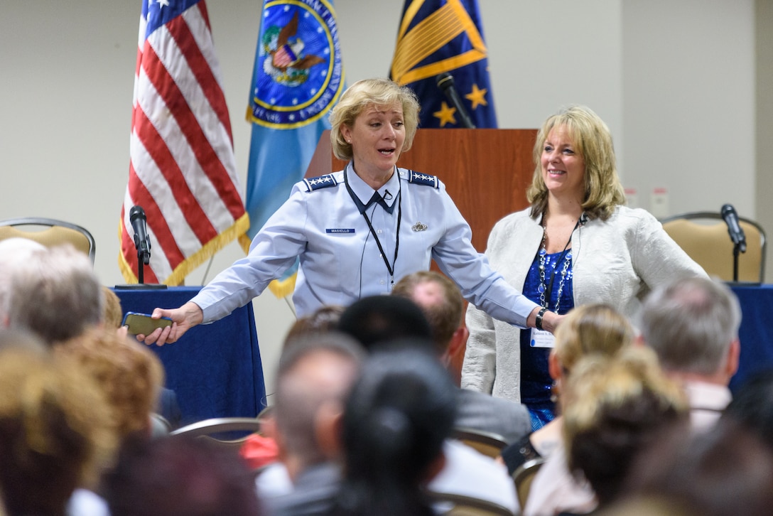 Kathy Butera, Defense Contract Management Agency Human Capital director, looks on as Air Force Lt. Gen. Wendy Masiello, agency director, talks with DCMA professionals during a recent three-day training workshop. (DCMA photo by Patrick Tremblay) 