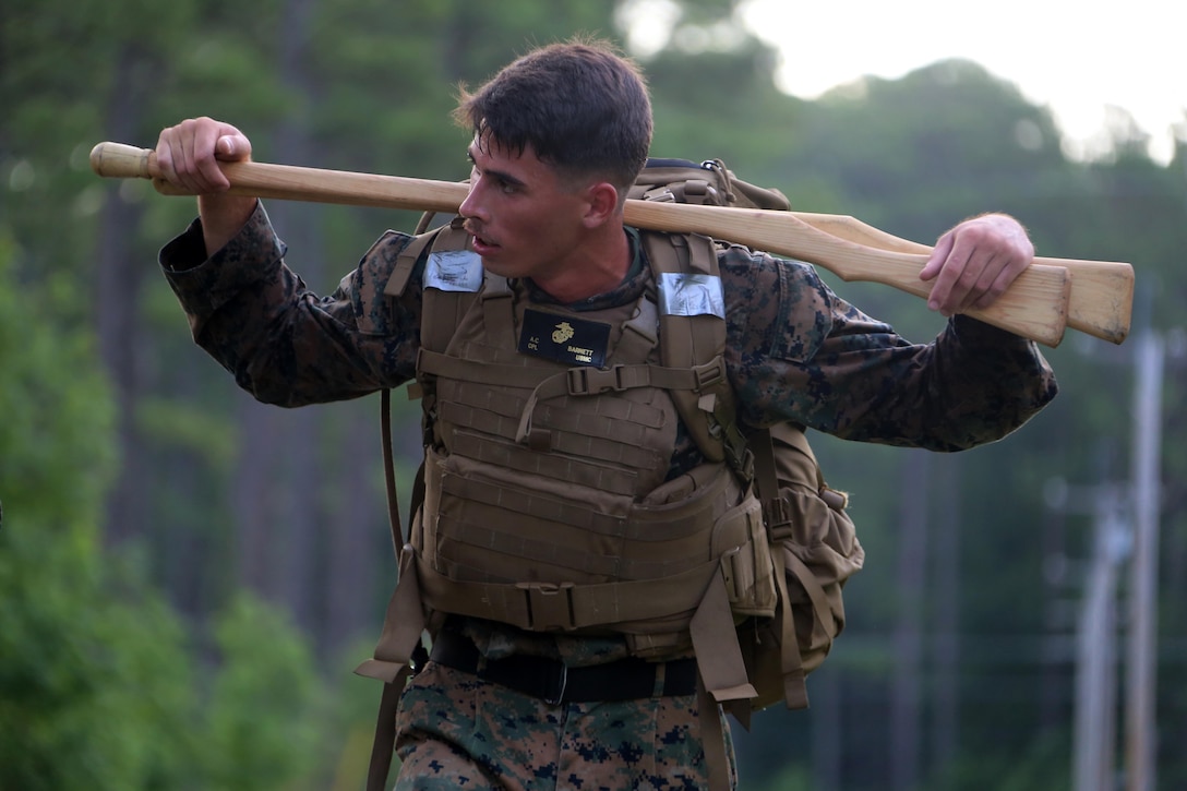 Cpl. Anthony Barnett hikes a trail during the four-and-a-half mile endurance course of a Marine Corps Martial Arts Instructor Course at Marine Corps Air Station Cherry Point, N.C., July 1, 2016. The endurance course was the culminating event of three weeks of physical, mental, and character challenges Marines assigned to Marine Wing Communications Squadron 28 completed to earn their instructor tabs. MCMAP is a combat system that trains Marines in the art of hand-to-hand and close quarters combat techniques while building morale and teamwork. This MCMAP instructor course was conducted by the unit to certify Marines with the responsibility of instructing and training Marines in MCMAP.  Barnett is a ground radar repairer assigned to MWCS-28, Marine Air Control Group 28, 2nd Marine Aircraft Wing. (U.S. Marine Corps photo by Cpl. N.W. Huertas/Released)      
