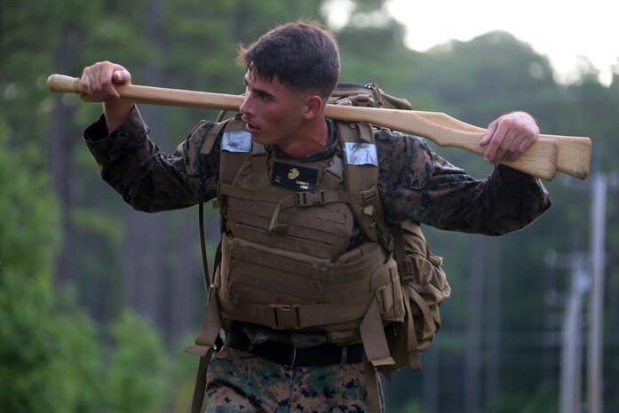 Cpl. Anthony Barnett hikes a trail during the four-and-a-half mile endurance course of a Marine Corps Martial Arts Instructor Course at Marine Corps Air Station Cherry Point, N.C., July 1, 2016. The endurance course was the culminating event of three weeks of physical, mental, and character challenges Marines assigned to Marine Wing Communications Squadron 28 completed to earn their instructor tabs. MCMAP is a combat system that trains Marines in the art of hand-to-hand and close quarters combat techniques while building morale and teamwork. This MCMAP instructor course was conducted by the unit to certify Marines with the responsibility of instructing and training Marines in MCMAP.  Barnett is a ground radar repairer assigned to MWCS-28, Marine Air Control Group 28, 2nd Marine Aircraft Wing. (U.S. Marine Corps photo by Cpl. N.W. Huertas/Released)      