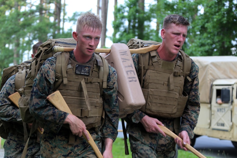 Marines with Marine Wing Communication Squadron 28 hike a trail during the four-and-a-half mile endurance course of a Marine Corps Martial Arts Instructor Course at Marine Corps Air Station Cherry Point, N.C., July 1, 2016. The endurance course was the culminating event of three weeks of physical, mental, and character challenges Marines assigned to MWCS-28 completed to earn their instructor tabs. MCMAP is a combat system that trains Marines in the art of hand-to-hand and close quarters combat techniques while building morale and teamwork. This MCMAP instructor course was conducted by the unit to certify Marines with the responsibility of instructing and training Marines in MCMAP. MWCS-28 is one of the squadrons assigned to Marine Air Control Group 28, 2nd Marine Aircraft Wing. (U.S. Marine Corps photo by Cpl. N.W. Huertas/Released)