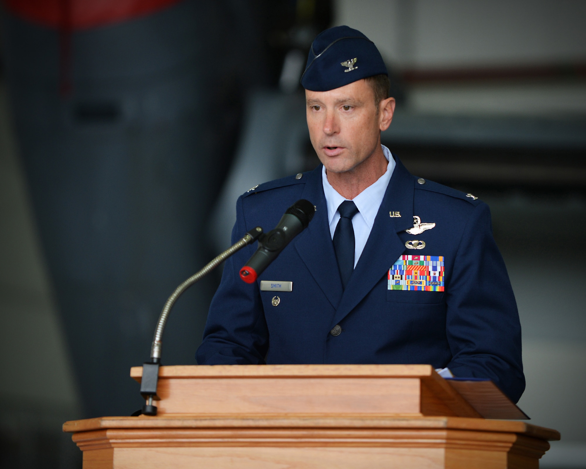 U.S. Air Force Col. Matthew Smith, 352nd Special Operations Wing commander, speaks during the 352 SOW change of command ceremony July 8, 2016, on RAF Mildenhall, England. Smith previously served as the 27th Special Operations Wing vice commander at Cannon Air Force Base, New Mexico and replaces former 352 SOW commander following U.S. Air Force Col. William Holt’s departure as part of routine military assignment rotations. (U.S. Air Force photo by Senior Airman Christine Halan/Released)