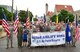 Commander of the 932nd Airlift Wing, Col. Jonathan Philebaum (center), led his wing volunteers on a 1.5 mile walk in the Saint Louis Independence Day 