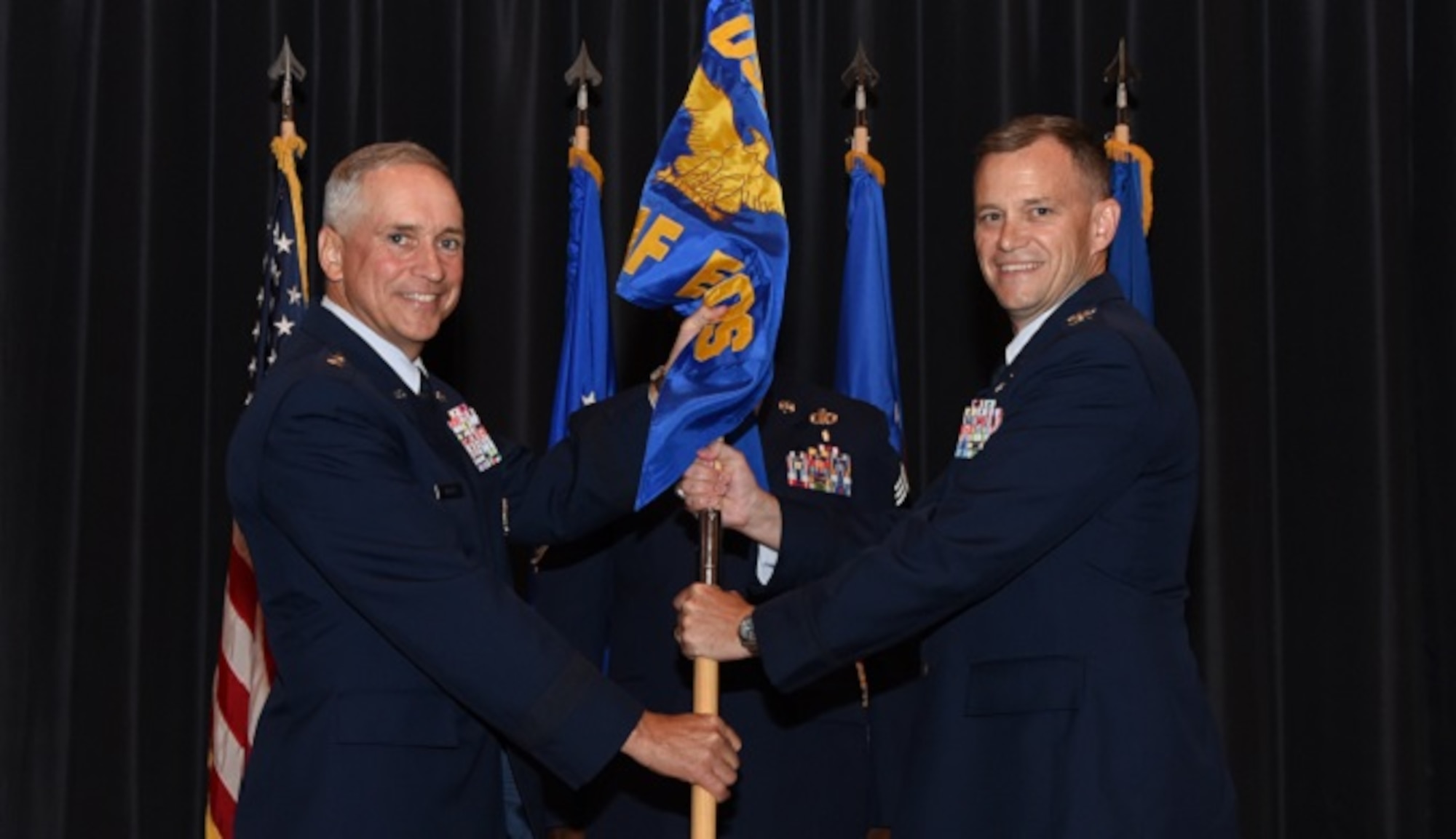 Col. Thomas J. O'Connell, Jr. (right), assumes command of the U.S. Air Force Expeditionary Operations School in a change-of-command ceremony at Joint Base McGuire-Dix-Lakehurst, N.J., July 7. Maj. Gen. Frederick Martin, U.S. Air Force Expeditionary Center commander, presided over the ceremony. Prior to taking command of the school, O'Connell served as the Chief of East and Southeast Contingency Plans within Pacific Command's Strategy and Policy Directorate near Honolulu, Hawaii. (U.S. Air Force photo by Tech. Sgt. Jaimie Powell)

