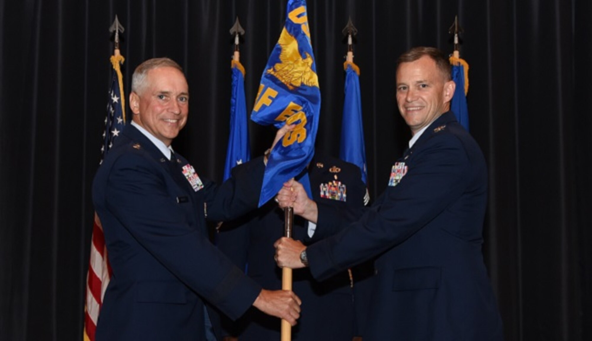 Col. Thomas J. O'Connell, Jr. (right), assumes command of the U.S. Air Force Expeditionary Operations School in a change-of-command ceremony at Joint Base McGuire-Dix-Lakehurst, N.J., July 7. Maj. Gen. Frederick Martin, U.S. Air Force Expeditionary Center commander, presided over the ceremony. Prior to taking command of the school, O'Connell served as the Chief of East and Southeast Contingency Plans within Pacific Command's Strategy and Policy Directorate near Honolulu, Hawaii. (U.S. Air Force photo by Tech. Sgt. Jaimie Powell)
