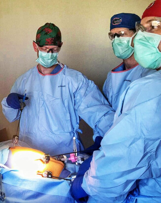 From left, Lt. Col. (Dr.) Shawnn Nichols, Maj. (Dr.) John Stowers and Capt. Stephen Smith perform the first laparoscopic gallbladder removal surgery during New Horizons 2016. Nichols and Stowers are with the 959th Medical Operations Squadron. Smith is with the 959th Clinical Support Squadron. (Courtesy photo)
