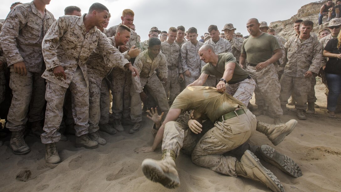 U.S. Marines with 1st Light Armored Reconnaissance Battalion grapple during Highlanders’ Night at Marine Corps Base Camp Pendleton, California, June 30, 2016. Highlanders’ Night is an annual event the battalion holds to celebrate its history and traditions while building camaraderie through competitive events.