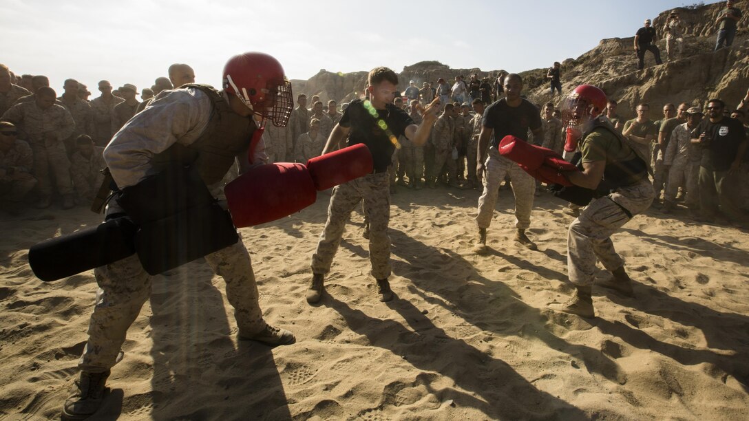 U.S. Marines with 1st Light Armored Reconnaissance Battalion bout with pugil sticks during Highlanders’ Night at Marine Corps Base Camp Pendleton, California, June 30, 2016. Highlanders’ Night is an annual event the battalion holds to celebrate its history and traditions while building camaraderie through competitive events.