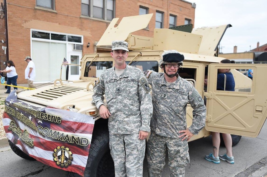 Sgt. Adam Burson, left, 416th Theater Engineer Command, and Master Sgt. Keith Clark, 85th Support Command, stand in front of a Humvee prior to Villa Park’s annual Fourth of July parade, July 4, 2016. 
 (U.S. Army photo by Spc. David Lietz/Released)