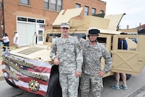 Sgt. Adam Burson, left, 416th Theater Engineer Command, and Master Sgt. Keith Clark, 85th Support Command, stand in front of a Humvee prior to Villa Park’s annual Fourth of July parade, July 4, 2016. 
 (U.S. Army photo by Spc. David Lietz/Released)