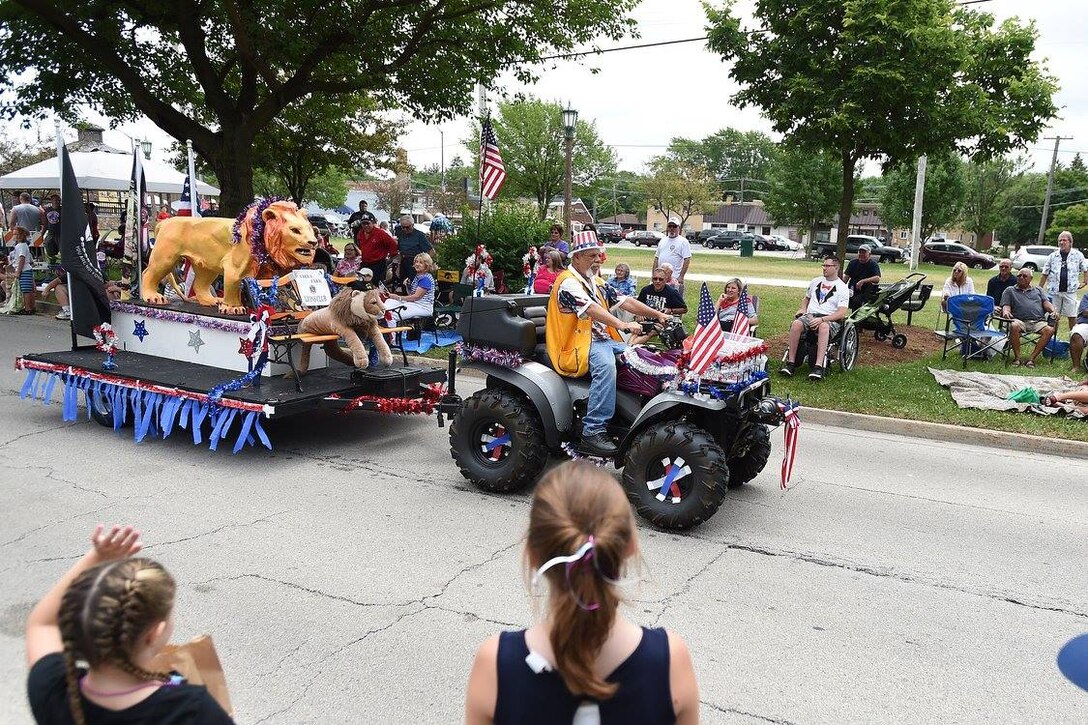 “Wild Bill” Reeves, a resident of Villa Park, drives the Villa Park Lions Club float during the annual Fourth of July Parade in Villa Park, July 4, 2016. Reeves is a Vietnam veteran and former Prisoner of War. He served in the U.S. Army from 1969 to 1972. He was stationed in Chu Lai and served as a door gunner on a Huey helicopter. 
 (U.S. Army photo by Spc. David Lietz/Released)