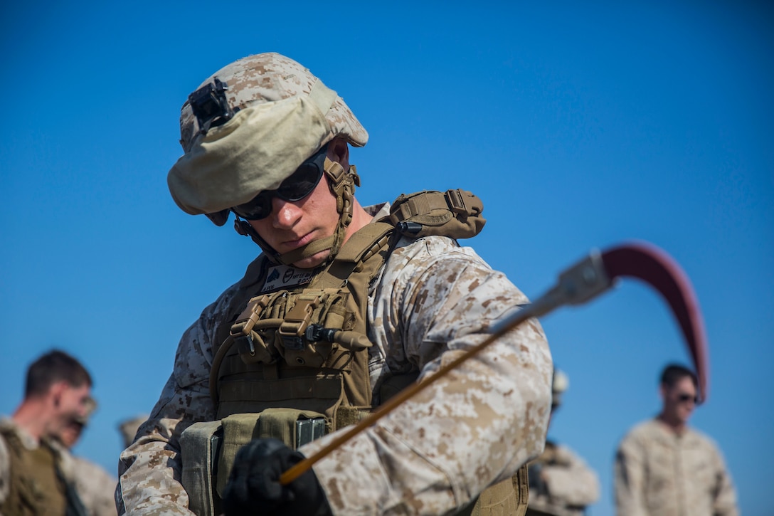 MARINE CORPS BASE CAMP PENDLETON, Calif. -- Corporal Brier Avara, a teamer lead with Law Enforcement Platoon, Koa Moana 16-4, extends a holly stick during counter improvised explosive devise training on Camp Pendleton June 23, 2016. A holly stick is used to help confirm the spotting of an IED. Koa Moana seeks to enhance senior military leader engagements between allied and partner nations with a collective interest in military-to-military relations, as well as discuss key aspects of military operations, capability development, and interoperability. (U.S. Marine Corps photo by Sgt. Tony Simmons)
