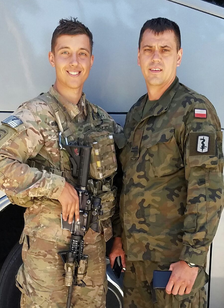 Army Spc. Ryan Krawczyk, left, an American paratrooper from 1st Brigade Combat Team, 82nd Airborne Division, poses for a photo with Waldemar Ufnal, a Polish paratrooper he spent time with during exercise Swift Response 2016 in Torun, Poland, June 16, 2016. Army photo by Staff Sgt. Javier Orona
