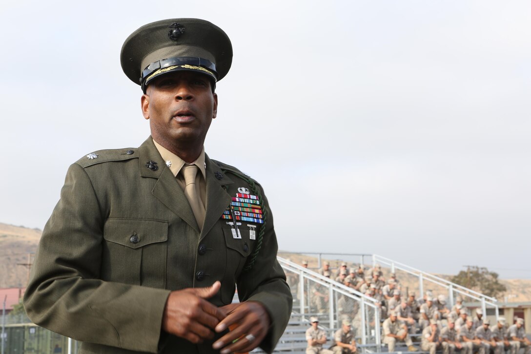 MARINE CORPS BASE CAMP PENDLETON, Calif. – Lt. Col. Rafael Candelario, executive officer of the 5th Marine Regiment, speaks to Marines of 5th Marine Regiment during a ceremony at Camp Pendleton, June 30, 2016. Candelario explained the significance of the fourragere and what it means to be a part of 5th Marine Regiment. The ceremony emphasized the Marines’ commitment to upholding the rich history of the Fighting Fifth. (U.S. Marine Corps photo by Pfc. Joseph Sorci/RELEASED)