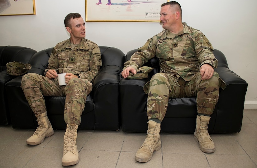 Cadet Spenser Copp, a native of Fairfax, Va. with F Company, 2nd Regiment at the U.S. Military Academy, West Point, N.Y. talks with Sgt. 1st Class Carl Addie, a Cabot, Arkansas native and the Civil Affairs Liaison Officer for Host Nation Affairs, ASG – Ku at the Kuwait Ministry of Defense, June 22. The cadet interned at Camp Arifjan, Kuwait from June 13 to July 1 as part of a unique, hands-on training opportunity hosted by U.S. Army Central’s Civil Military Operations and HNA, ASG – Kuwait.