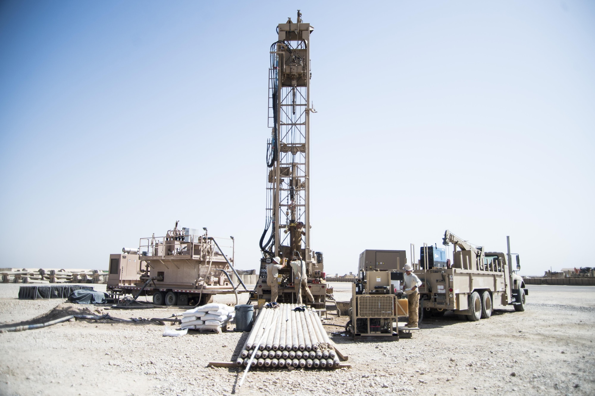 Airmen assigned to the 557th Expeditionary Red Horse Squadron, work at the well drilling site on Al Taqaddum Air Base, Iraq, June 2, 2016. The 557th ERHS well drilling team are obtaining an organic water source for Al Taqaddum. Red Horse is helping to improve Iraq's infrastructure in support of the Government of Iraq.
(U.S. Air Force photo/Staff Sgt. Larry E. Reid Jr., Released)