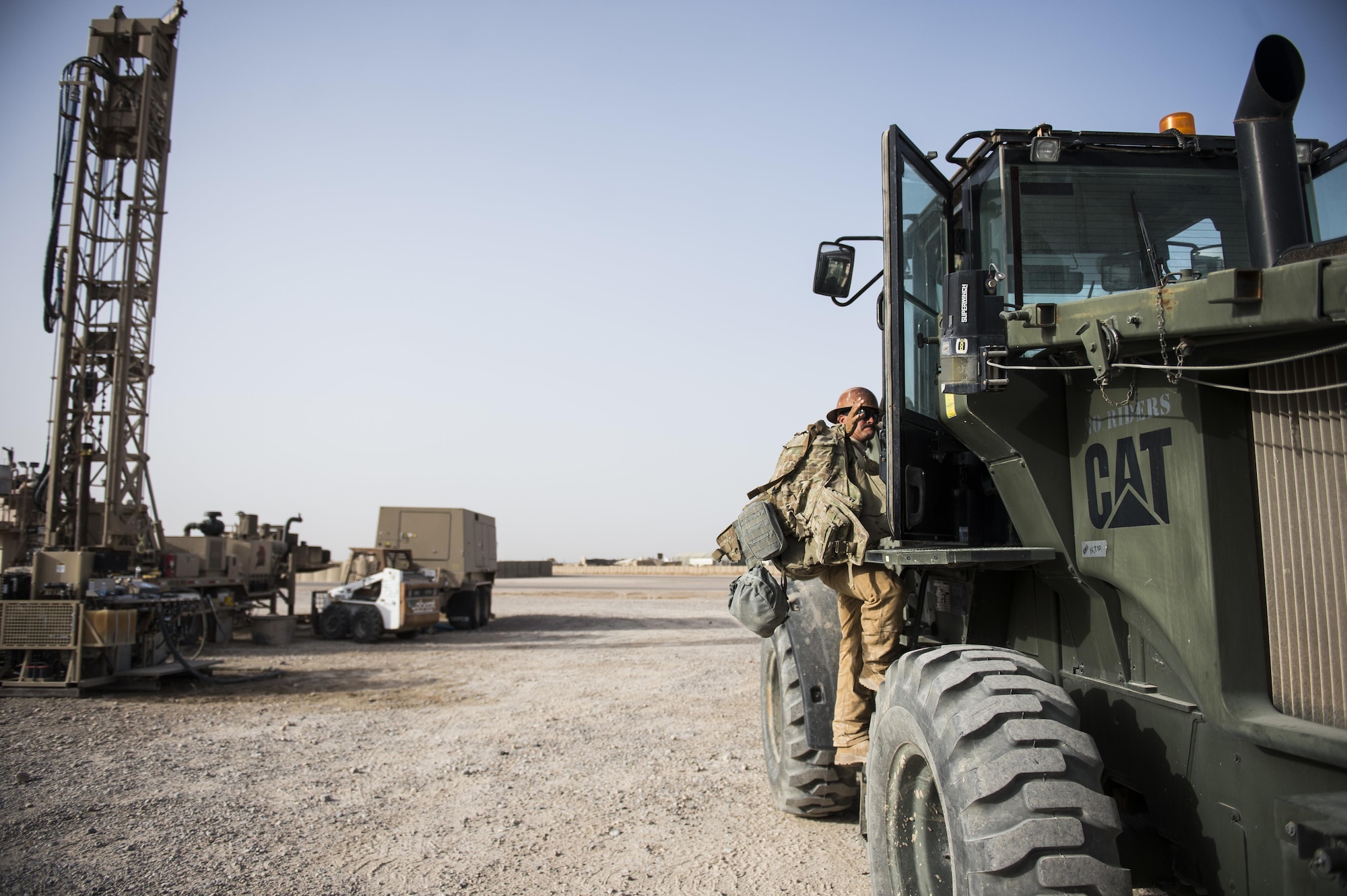 Staff Sgt. David Smith, a well drilling technician assigned to the 557th Expeditionary Red Horse Squadron, climbs into a forklift at Al Taqaddum Air Base, Iraq, June 3, 2016. The 557th ERHS well drilling team are obtaining an organic water source for Al Taqaddum. Red Horse is helping to improve Iraq's infrastructure in support of the Government of Iraq.
(U.S. Air Force photo/Staff Sgt. Larry E. Reid Jr., Released)