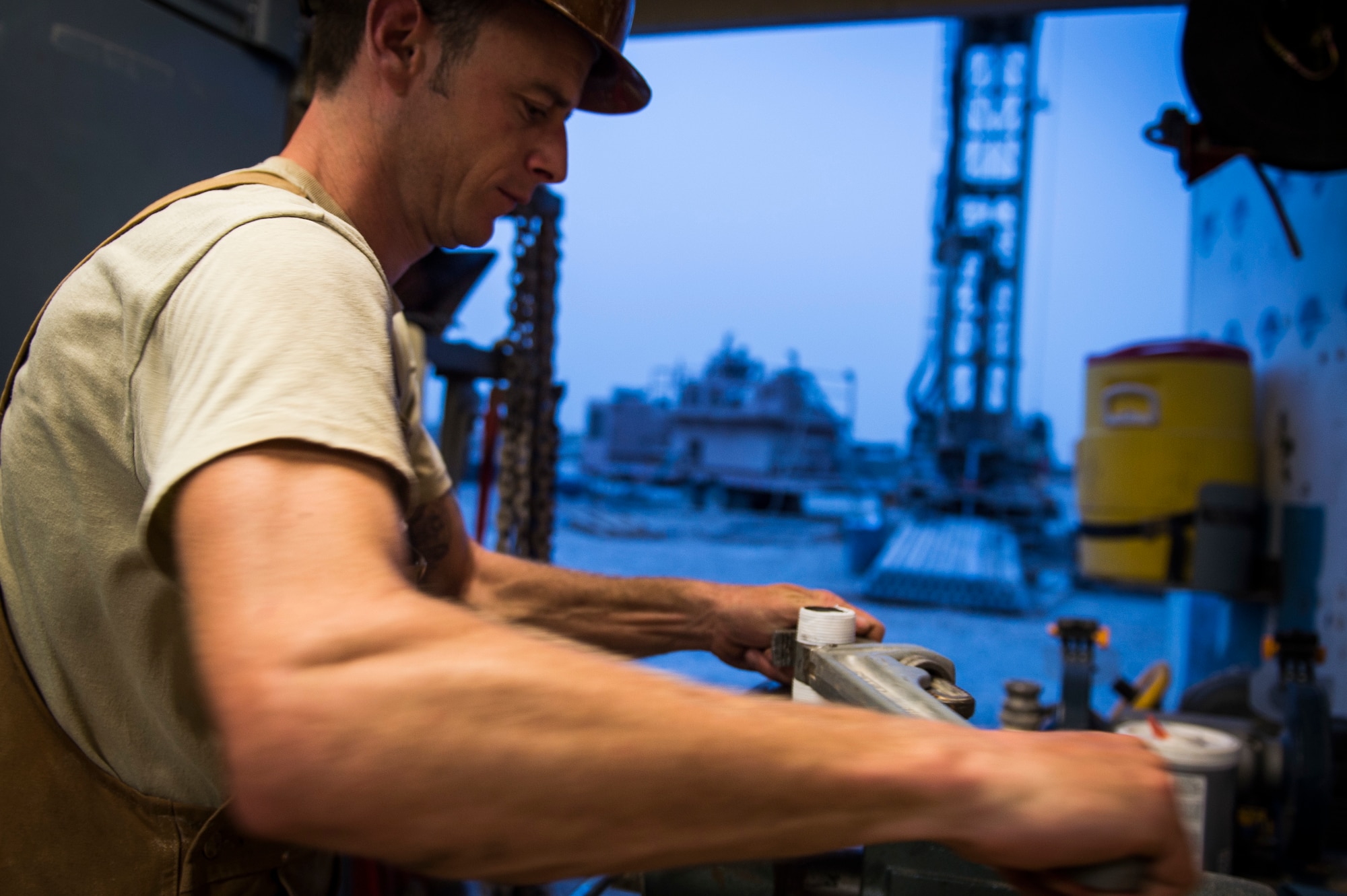 Tech. Sgt. Randy Blount, a well drilling technician assigned to the 557th Expeditionary Red Horse Squadron, tightens down a piece of metal at Al Taqaddum Air Base, Iraq, June 3, 2016. The 557th ERHS well drilling team are obtaining an organic water source for Al Taqaddum. Red Horse is helping to improve Iraq's infrastructure in support of the Government of Iraq.
(U.S. Air Force photo/Staff Sgt. Larry E. Reid Jr., Released)