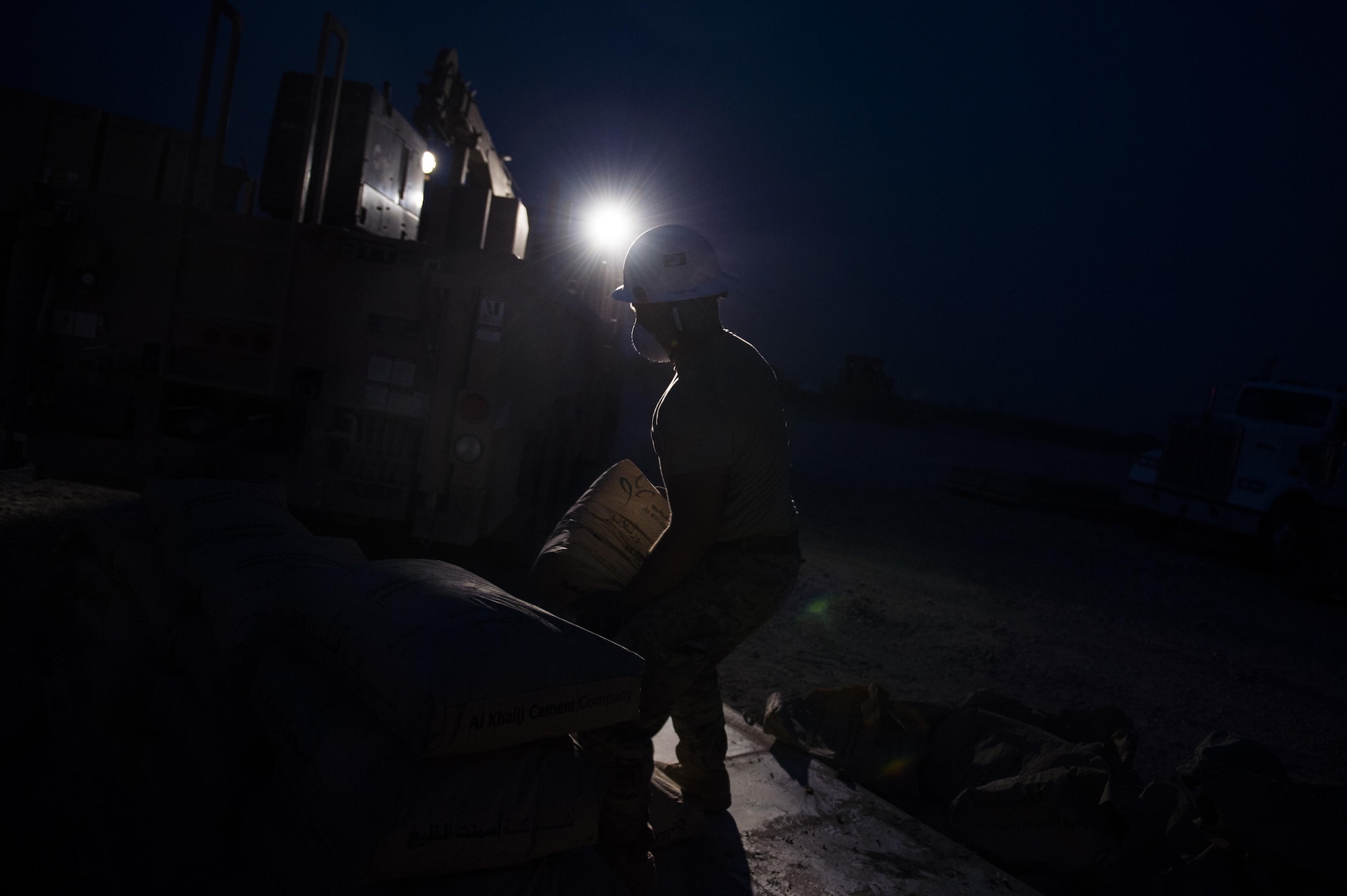 Tech. Sgt. Jason Caceres, 557th Expeditionary Red Horse Squadron well drilling NCOIC, stacks a package of cement onto a pallet at Al Taqaddum Air Base, Iraq, June 3, 2016. The 557th ERHS well drilling team are obtaining an organic water source for Al Taqaddum. Red Horse is helping to improve Iraq's infrastructure in support of the Government of Iraq.
(U.S. Air Force photo/Staff Sgt. Larry E. Reid Jr., Released)