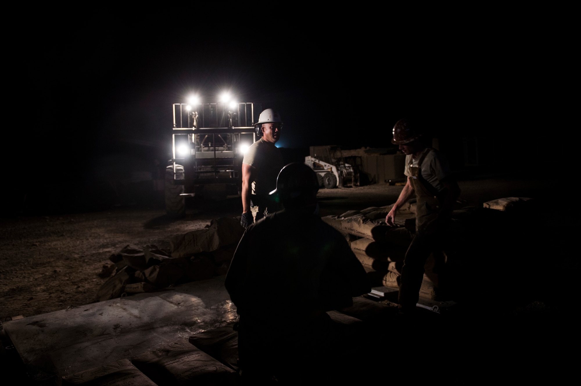Tech. Sgt. Jason Caceres, 557th Expeditionary Red Horse Squadron well drilling NCOIC, provides instruction before loading more packages of cement onto the pallet at Al Taqaddum Air Base, Iraq, June 3, 2016. The 557th ERHS well drilling team are obtaining an organic water source for Al Taqaddum. Red Horse is helping to improve Iraq's infrastructure in support of the Government of Iraq.
(U.S. Air Force photo/Staff Sgt. Larry E. Reid Jr., Released)