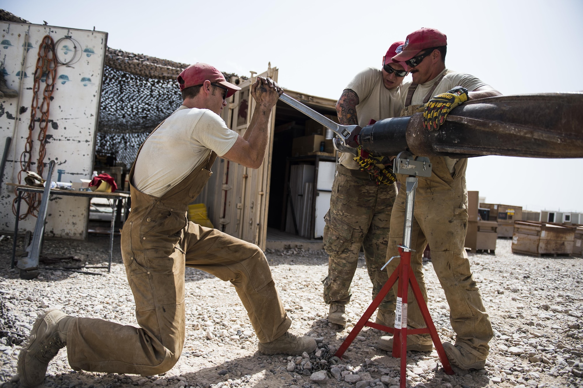 Tech. Sgt. Randy Blount (left), a well drilling technician assigned to the 557th Expeditionary Red Horse Squadron, loosens  a rod on a piece of well drilling equipment at Al Taqaddum Air Base, Iraq, June 5, 2016. The 557th ERHS well drilling team are obtaining an organic water source for Al Taqaddum. Red Horse is helping to improve Iraq's infrastructure in support of the Government of Iraq.
(U.S. Air Force photo/Staff Sgt. Larry E. Reid Jr., Released)