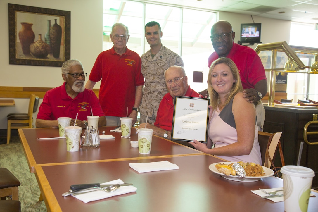 Members of the Veterans of Foreign Wars Post 12039 pose for a portrait with the Employee of the Quarter for Marine Corps Logistics Base Barstow during a luncheon, Jun. 29. Left to right: Richard Hawkins, U.S. Army and Air Force veteran; Philip Davis, U.S. Army veteran; Sgt. Marvin MontesCruz, command headquarters noncommissioned officer aboard MCLBB; Robert Hart, Air Force veteran; William Ponder, Marine Corps veteran; Katherine Fortune, command headquarters secretary for MCLBB headquarters.  