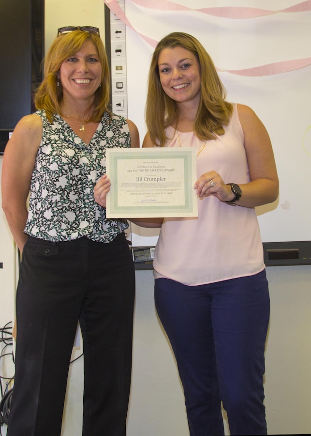 Jill Crumpler, coordinator for Marine Corps Family Team Building aboard Marine Corps Logistics Base Barstow, poses with Julie Wilbanks, Marine Corps Community Service liaison, in a final goodbye, Jun. 29. Crumpler and her family are heading on to the next phase in her husband's Army career in Savannah, Georgia. 