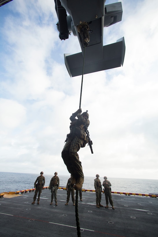 Marines conduct fast-rope training from the back of an MV-22 Osprey aircraft aboard the amphibious assault ship USS Wasp in the Atlantic Ocean, July 5, 2016. Marine Corps photo by Lance Cpl. Koby I. Saunders
