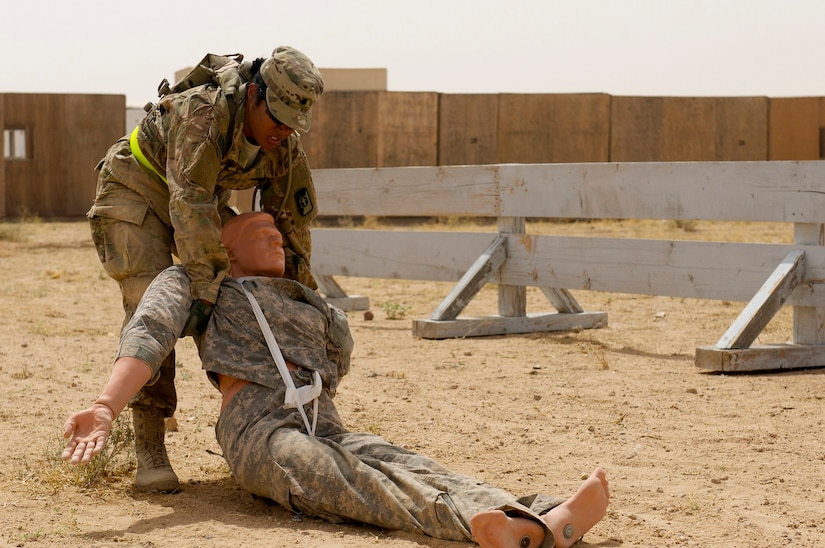 Spc. Dayanna Sanchez, a radiology specialist with the 53rd Head and Neck Surgical Team assigned at Camp Arifjan, Kuwait, and native of Havana, Cuba, drags a life-size dummy during the 2016 USARCENT Soldier of the Year Competition, June 20, 2016. Sanchez’ hard work and dedication recently afforded her the opportunity to be the only female Soldier to participate in the competition.